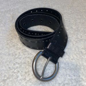 Black fossil belt with flower imprints